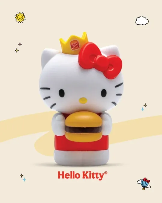 Hello Kitty de laço vermelho segurando um hambúrguer